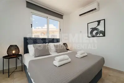 a bedroom with a bed with towels on it at Apartment Anabelle in Paralimni