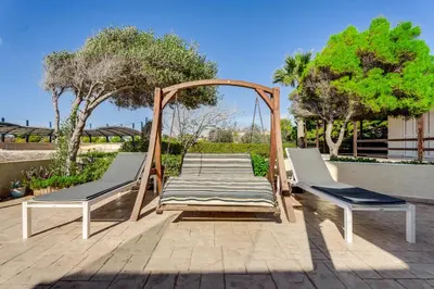 a gazebo and two chairs on a patio at Ayia Napa Villa Jasmine Sirens Beach Dom na Cyprze in Ayia Napa