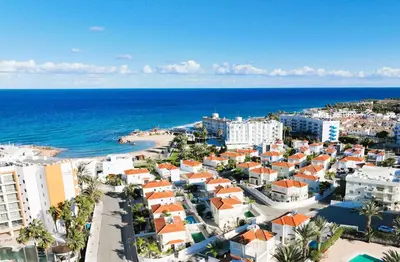 an aerial view of a city and the ocean at Villa Aurora - 100m from Pernera Beach in Protaras