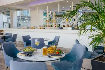 a table with food and drinks in a restaurant at River Rock Hotel in Ayia Napa
