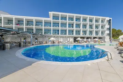 a swimming pool in front of a hotel at River Rock Hotel in Ayia Napa