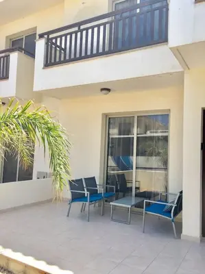 a patio with chairs and a table in front of a building at Maison Diana - Tourism license 6990 in Protaras