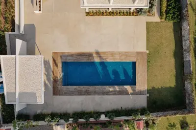 an overhead view of a swimming pool in a yard at Protaras Eden Seaside Suite in Protaras