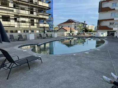 a swimming pool in the middle of a building at Limassol Beautiful Apartment in Limassol