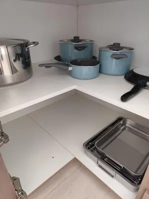 a kitchen with three pots and pans on a counter at Marina view seaside apartment in Larnaka