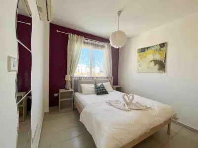 a bedroom with a bed and a window at Thaleia Suite - Tourism License 3119 in Protaras