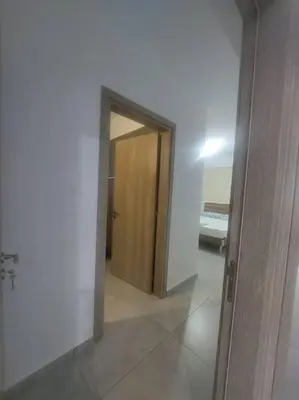 a hallway with a door leading to a bedroom at Luxury 2 bedroom apartment in Larnaka