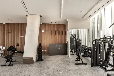 a gym with treadmills and cardio equipment in a building at Ayia Napa Marina East Tower Suite in Ayia Napa