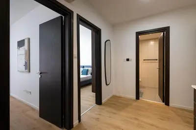 a hallway with a door leading to a bedroom at Paradise Apartment with Private Pool & Sea View in Larnaka