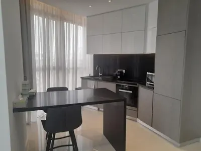 a kitchen with a table and two chairs in it at 360 Building - City View 2 Bedroom Residence in Nicosia