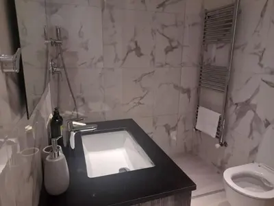 a bathroom with a sink and a toilet at 360 Building - City View 2 Bedroom Residence in Nicosia