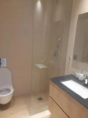 a bathroom with a toilet and a sink and a shower at 360 Nicosia-2 Bedroom City Tower in Nicosia