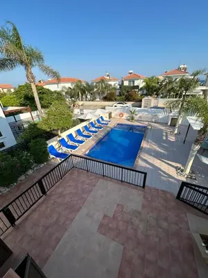 an overhead view of a swimming pool with lounge chairs at Ayia Napa Marina Luxury Villas - Diamond in Ayia Napa