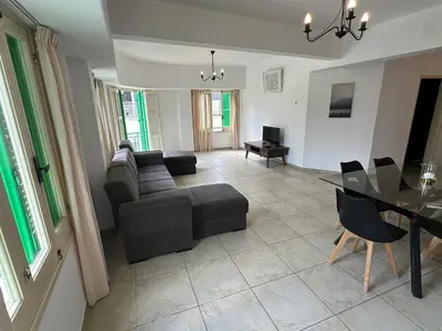 a living room with a couch and a table at city center accommodation in Nicosia