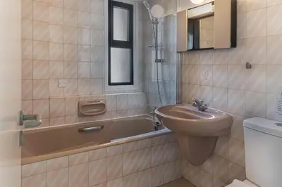 a bathroom with a sink and a tub and a toilet at Phaedrus Living Seaview Phinikoudes Flat in Larnaka