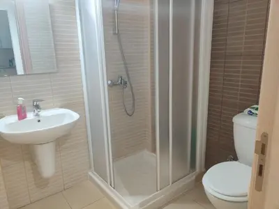 a bathroom with a shower and a sink and a toilet at Luxary Vacation by the Sea Protaras in Protaras