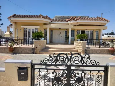 a house with a gate in front of it at Vasilis family room in Mor Menekshe