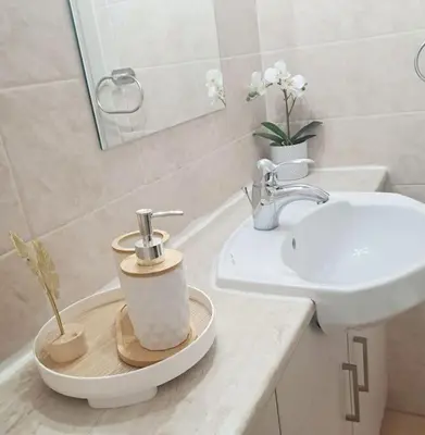 a bathroom with a sink and a toilet at CyPresa Sweet Home Oroklini in Larnaka