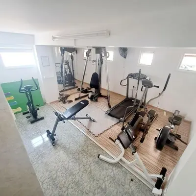 a gym with several exercise equipment in a room at CyPresa Sweet Home Oroklini in Larnaka