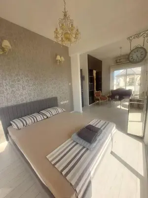 a bedroom with a large bed in a room at Central 1 bedroom lux apartment in Larnaka