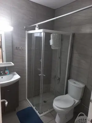 a bathroom with a shower with a toilet and a sink at Oroklini, Cyprus in Voroklini