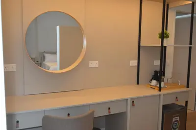 a dressing table with a mirror and a chair at LEONDIANA Boutique Hotel in Larnaka