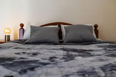 a bedroom with a bed with two pillows at Villa Alexander The Great in Protaras