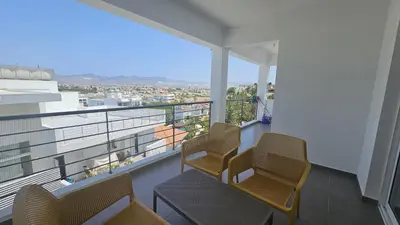 a balcony with chairs and a view of a city at STAY Space View Apartment in Nicosia