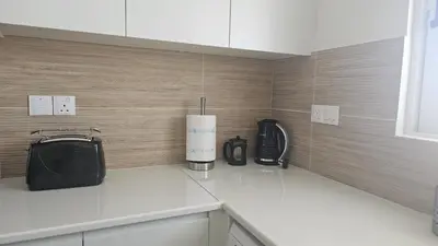 a kitchen with a counter top with appliances on it at STAY Space View Apartment in Nicosia