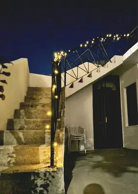 a staircase with lights on a house at night at Villa Christothea in Paphos