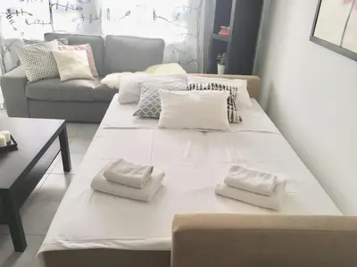 a large white couch in a living room at Niove Budget One-Bedroom Apartment in Paralimni