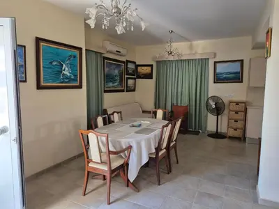 a dining room with a table and chairs at Villa Amaryllis in Paralimni