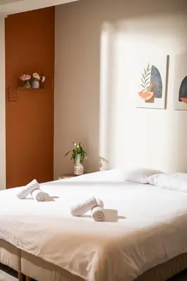 a bedroom with a bed with two towels on it at Spacious studio located in the pedestrian zone in Nicosia