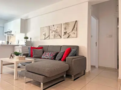 a living room with a couch and a table at Albert's Apartment Center 21 in Larnaka