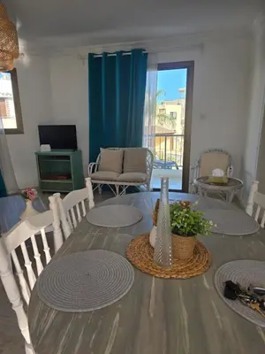 a dining room with a table and chairs at Irenes Apartment in Larnaka