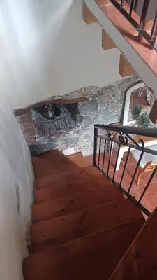 an overhead view of a stairs with a fireplace at George's House in Askas