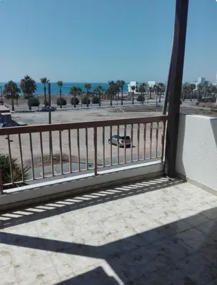 a balcony with a view of the beach and the ocean at Sweet Home by the sea in Pyla