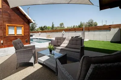a patio with a couch and chairs and a table at Ktima To Alliotiko - Lofou 2 in Lofou