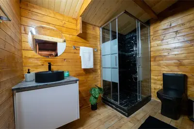 a bathroom with a glass shower and a sink at Ktima To Alliotiko - Lofou 2 in Lofou