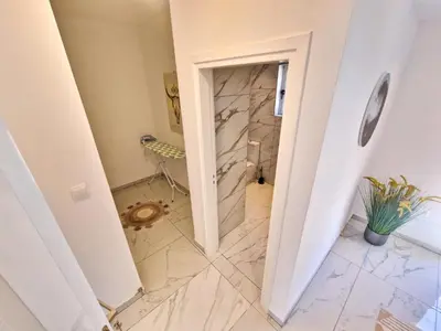 a bathroom with a walk in shower and a toilet at Sunshine Villa Ayia Napa in Ayia Napa