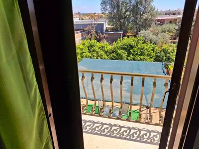 a balcony with a view of a pool at Grandma's House in Liopetri
