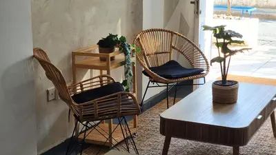 two chairs and a table in a room at Boho Greek Haven with Orange Grove Views Near Beach in Larnaka