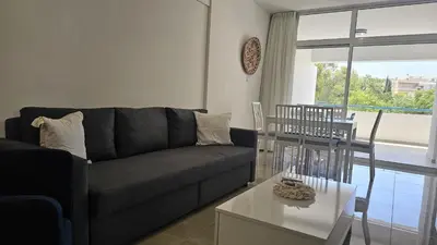 a living room with a couch and a table at STAY Local Apartment in Larnaka