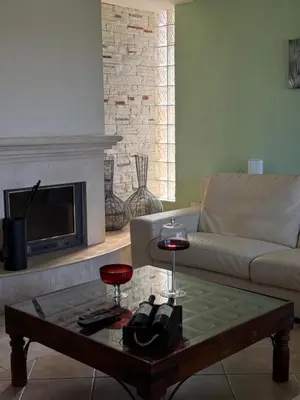 a living room with a couch and a coffee table at Maison Andre in Pano Lefkara