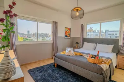 a bedroom with a bed with a basket on it at Two Bedroom Apartment, Spacious & Newly Renovated, Three Minutes from the Beach in Limassol