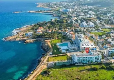 an aerial view of a resort next to the ocean at Coralli Privileges Apt in Protaras