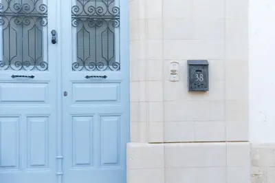 a blue door on a building with a mailbox at ANANKE Home in Nicosia