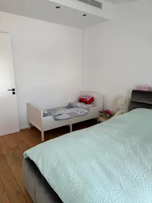 a bedroom with a bed and a small table at Larnaca Centre Villa in Larnaka