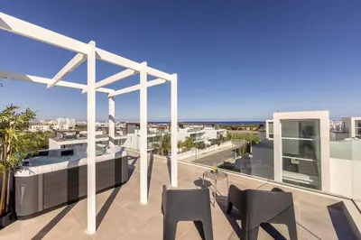 a balcony with chairs and a view of the ocean at Protaras Bay View Villa 11 in Protaras