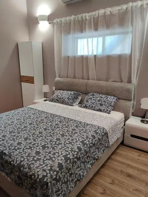 a bedroom with a large bed and a window at Studio in the centre of Nicosia 2 in Nicosia